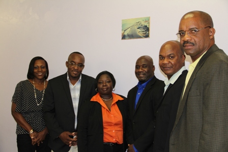 Minister of Housing and Lands in the Nevis Island Administration and Chairman of the Nevis Housing and Land Development Corporation Board of Directors Hon. Alexis Jeffers (third from right) with fellow members (L-R) Ms. Melissa Seabrookes, Board Secretary Mr. Oscar “Astro” Browne Ms. Juletta Jeffers, Mr. Leon Lescott and Dr. Cardell “Bal” Rawlins